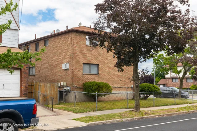 a view of balcony with wooden wall and outdoor seating