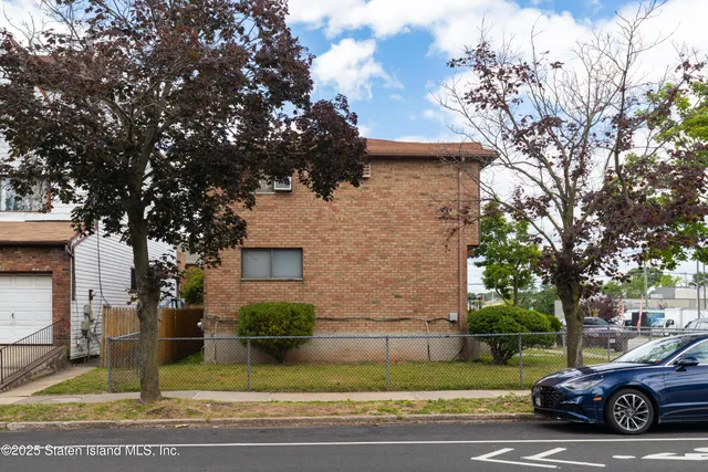 a view of a street with cars on road