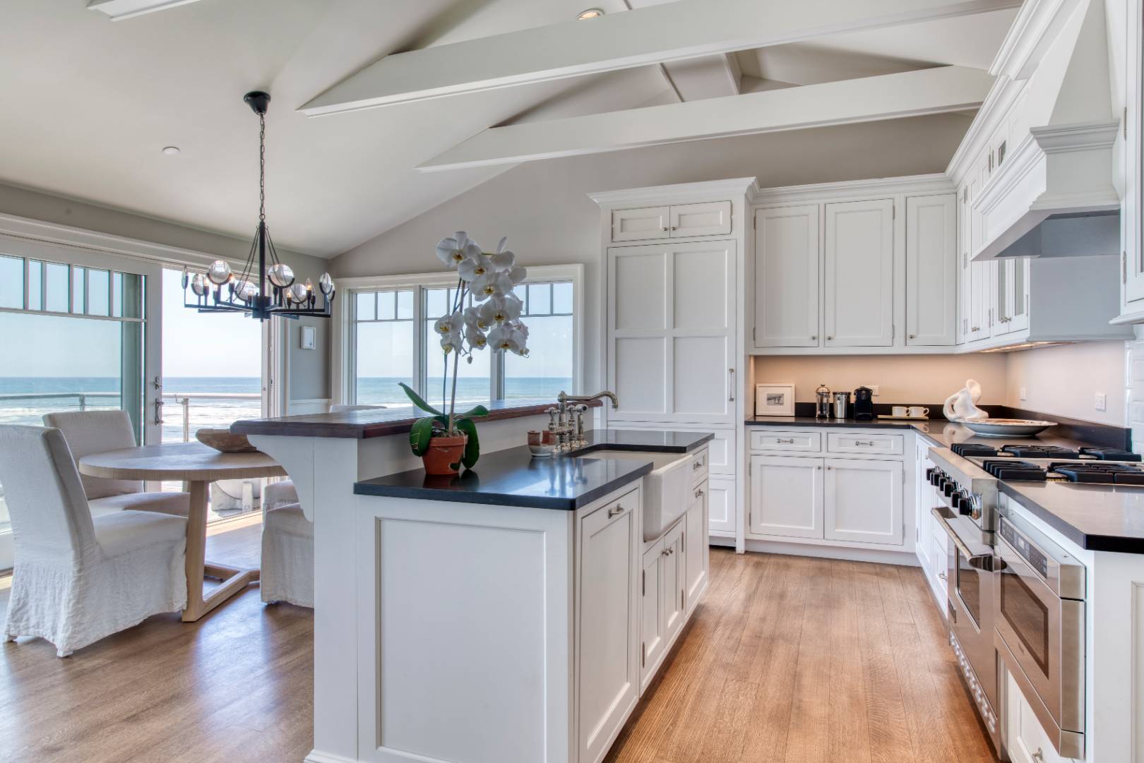 272 Old Montauk Highway, Unit 9 Montauk, NY 11954 - Photo 5 of 26 a kitchen with granite countertop a sink stove and cabinets