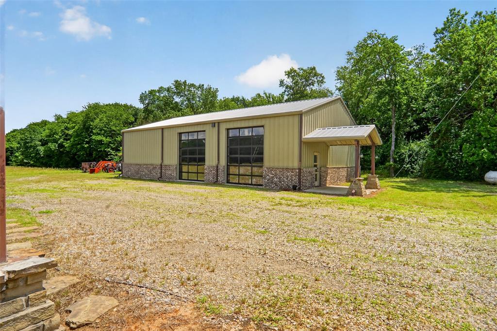 1524 County Road Sumner, TX 75486 - Photo 34 of 35 40x60 Detached shop with 3 total roll up doors.