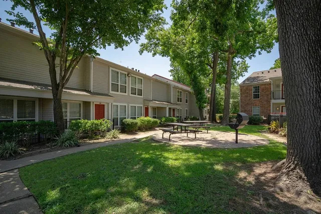 a view of a house with a yard porch and sitting area