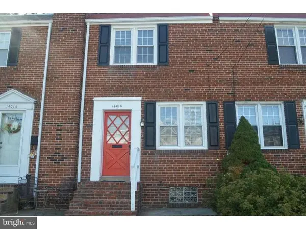 a view of a brick building with windows