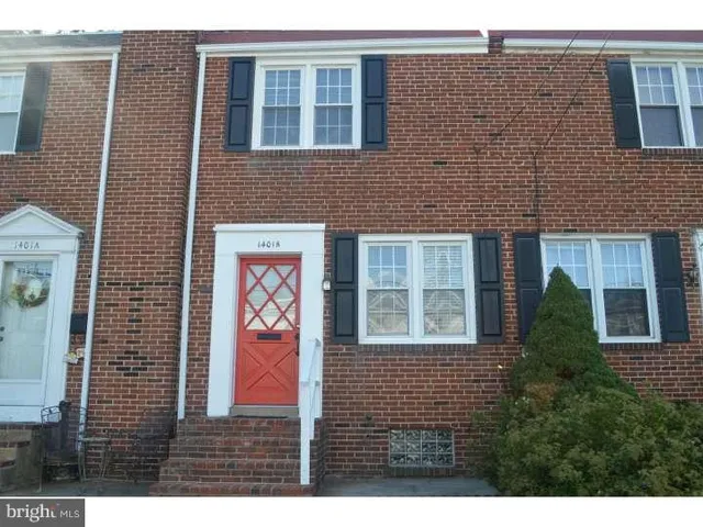 a view of a brick building with windows