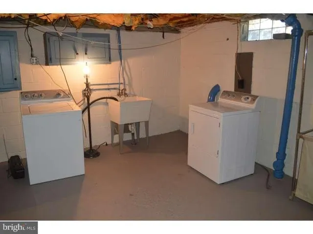 a view of a backyard with a fence