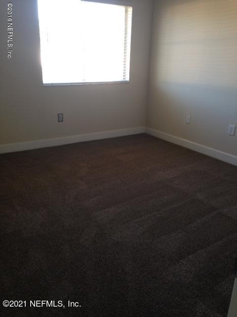 9745 Touchton Road, Unit 1823 Jacksonville, FL 32246 - Photo 13 of 18 an empty room with a window