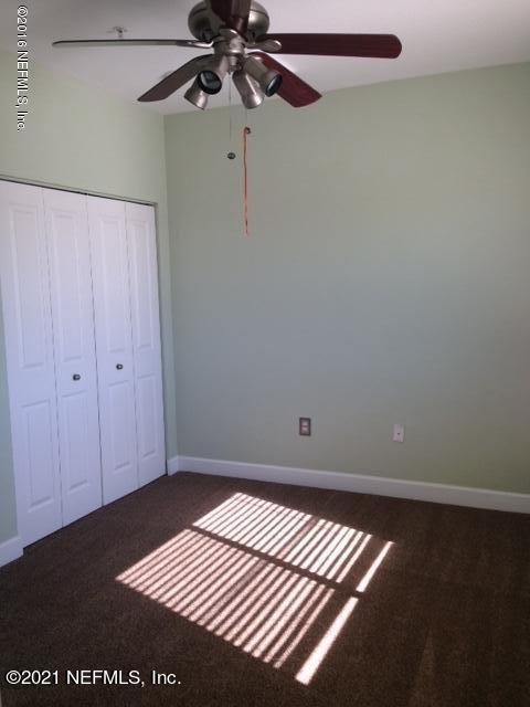 9745 Touchton Road, Unit 1823 Jacksonville, FL 32246 - Photo 17 of 18 a view of an empty room with a window