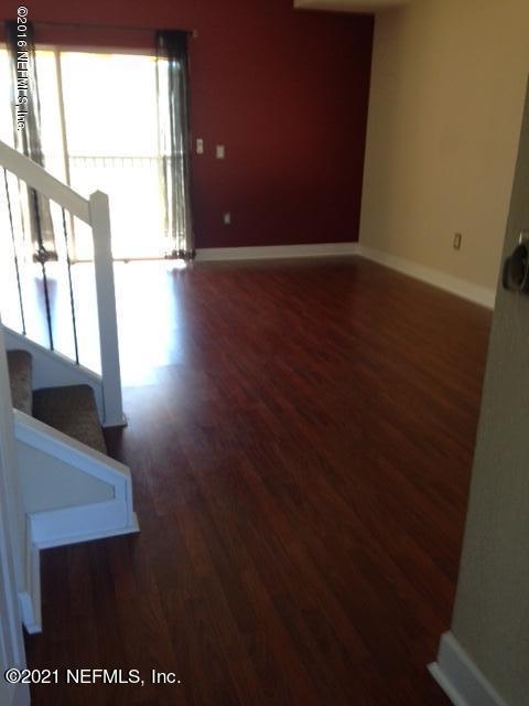 9745 Touchton Road, Unit 1823 Jacksonville, FL 32246 - Photo 5 of 18 a view of an empty room with a window