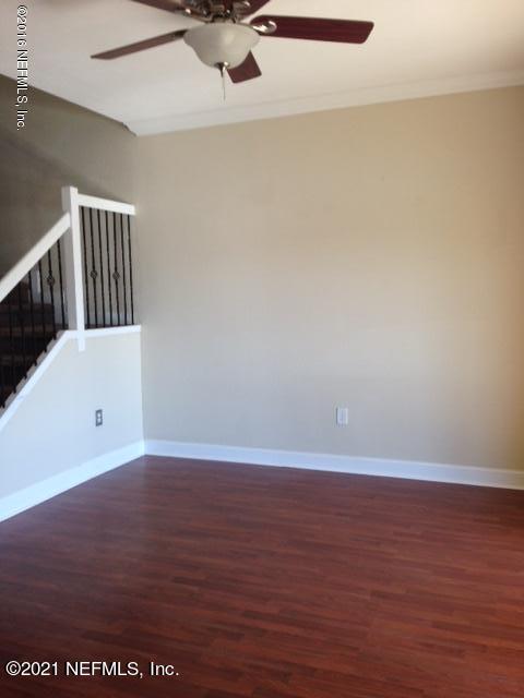 9745 Touchton Road, Unit 1823 Jacksonville, FL 32246 - Photo 8 of 18 a view of an empty room with wooden floor