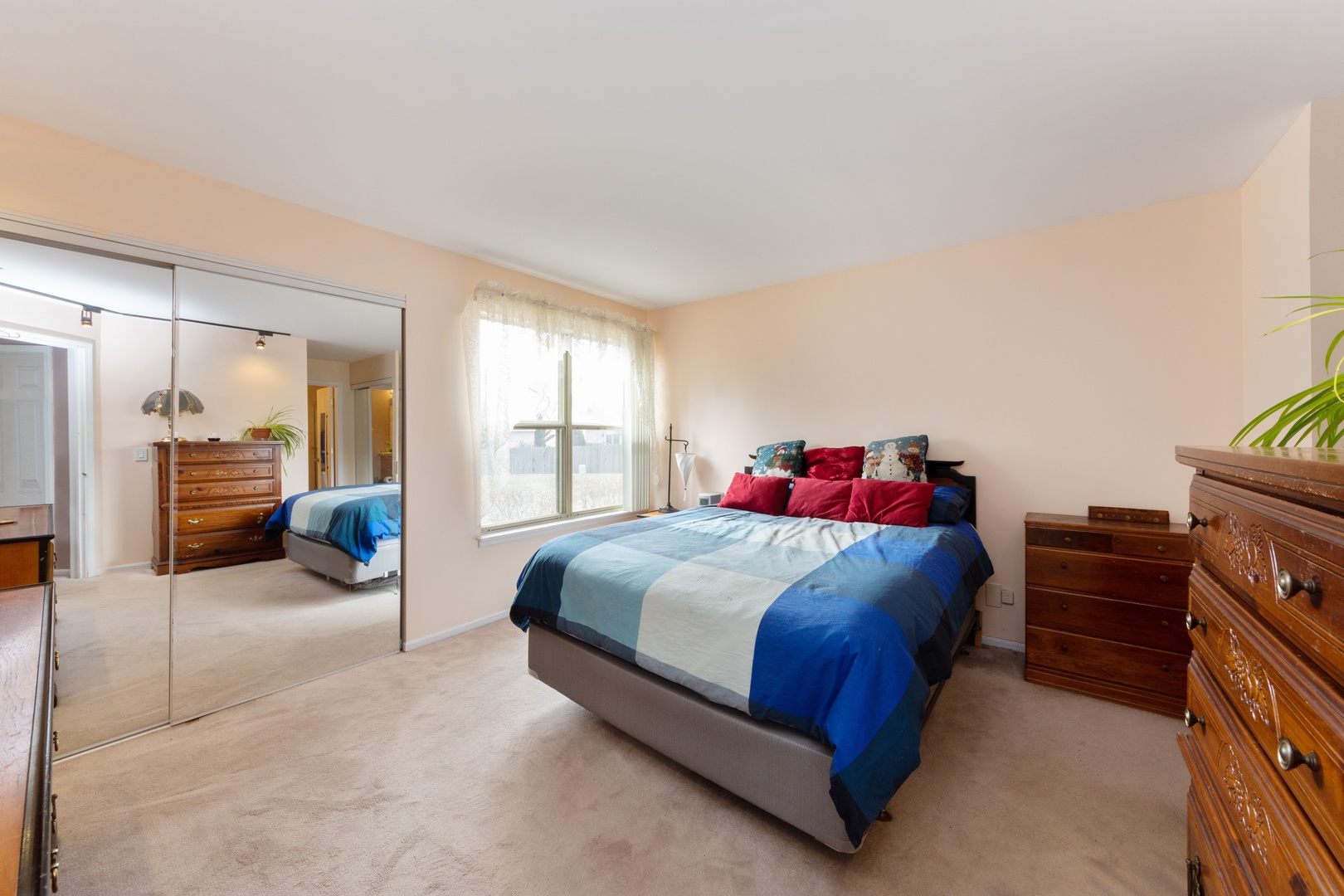 994 Ridgefield Lane, Unit 51 Wheeling, IL 60090 - Photo 7 of 10 a bedroom with a bed and a furniture