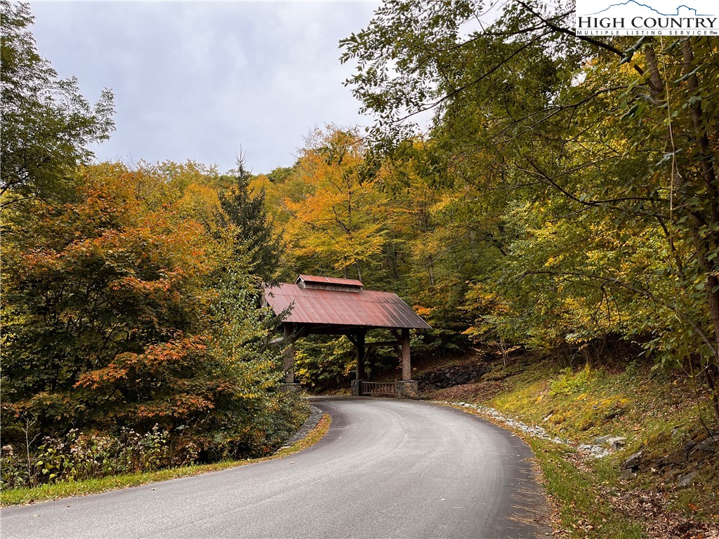 Lot 63 Bob Timberlake Drive Boone, NC 28607 - Photo 15 of 19 a backyard of a house with table and chairs