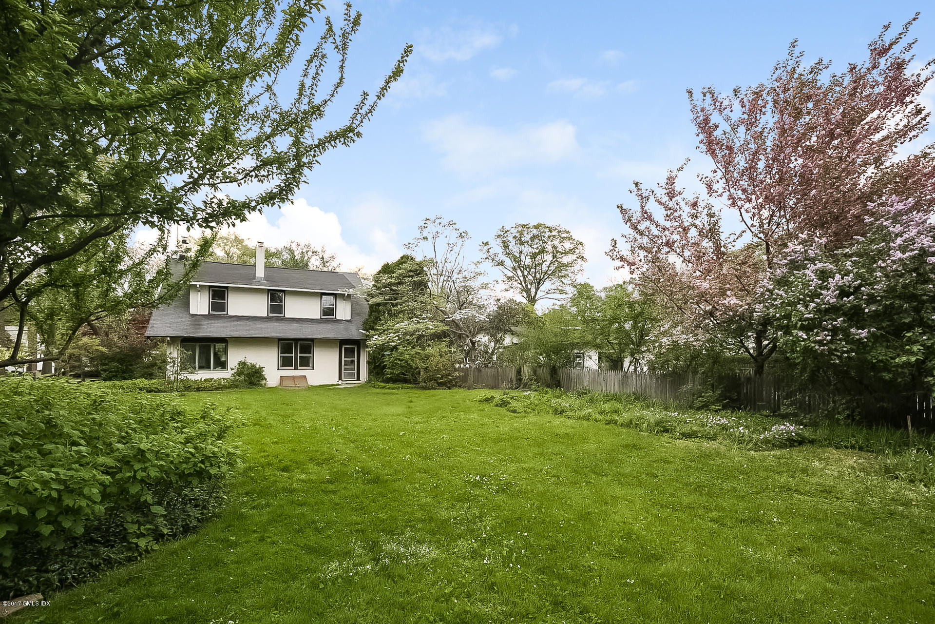 83 Indian Field Road Greenwich, CT 06830 - Photo 3 of 18 a house view with a garden space
