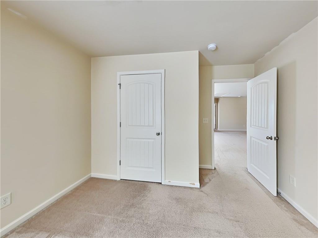 7770 Harbison Hollow Lane Suwanee, GA 30024 - Photo 14 of 25 a view of an empty room