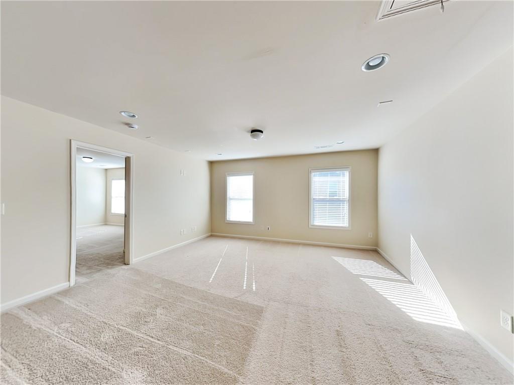 7770 Harbison Hollow Lane Suwanee, GA 30024 - Photo 22 of 25 a view of an empty room and window