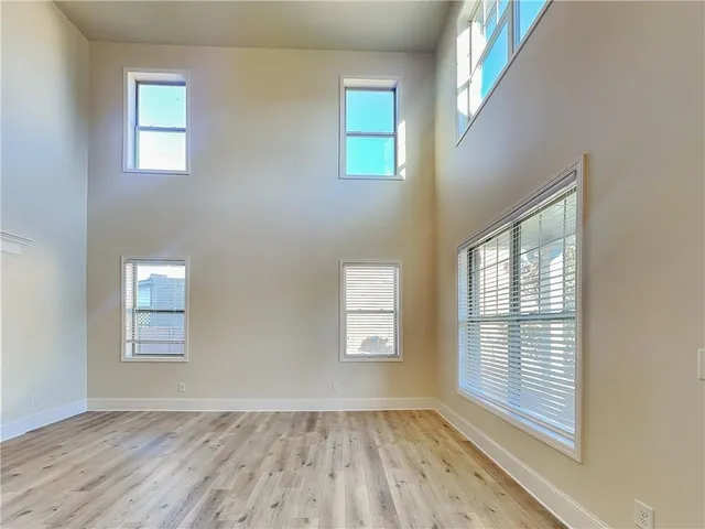 a spacious bathroom with a sink a mirror and a shower