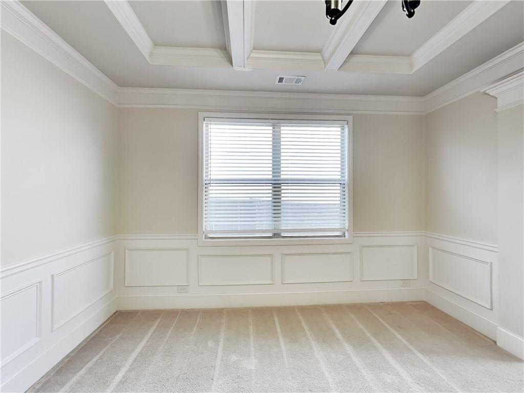 7770 Harbison Hollow Lane Suwanee, GA 30024 - Photo 6 of 25 a view of an empty room with a window