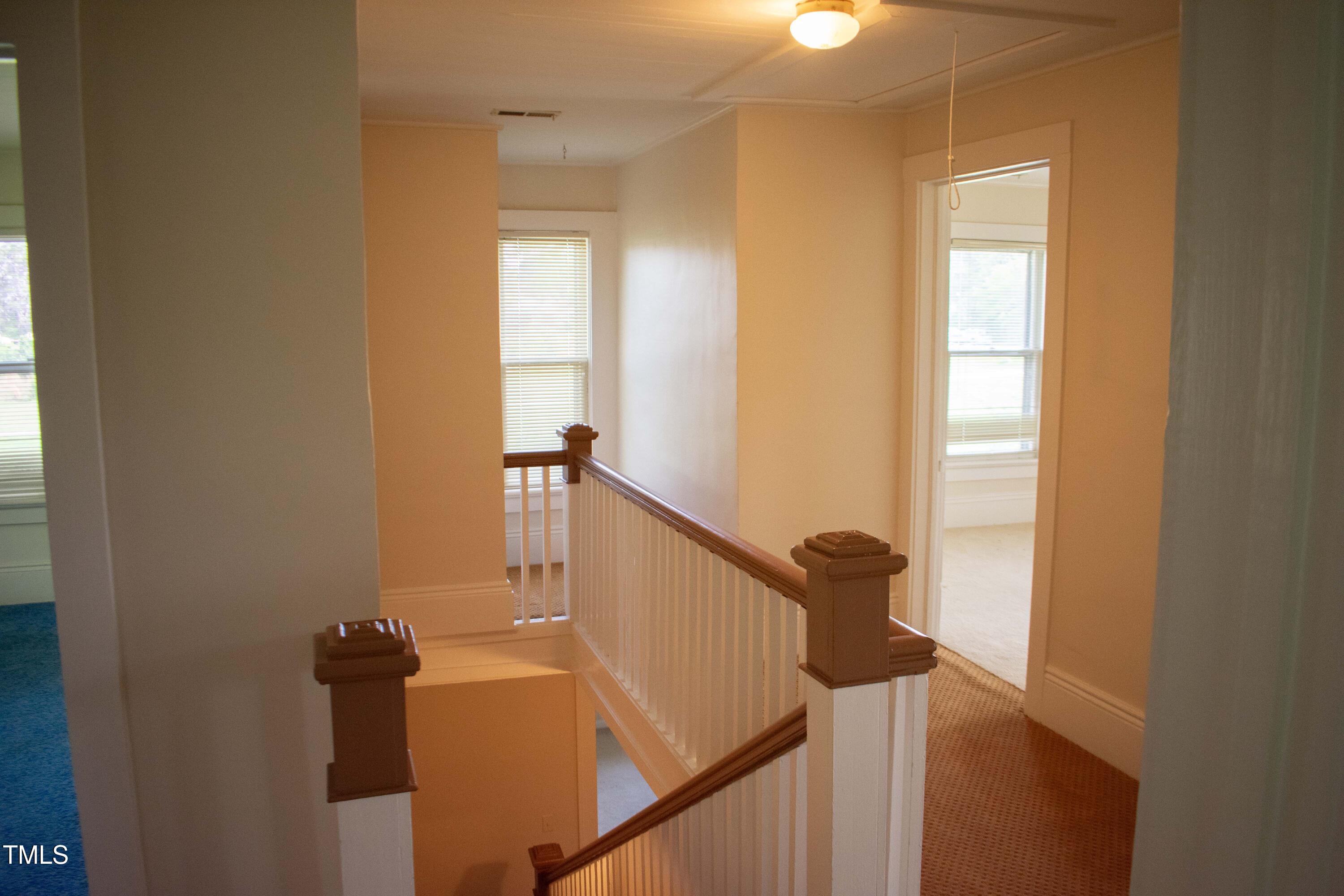2024 Zebulon Road Zebulon, NC 27597 - Photo 13 of 16 a view of entryway and hall with wooden floor