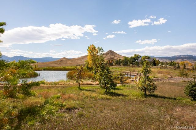 a view of a lake with houses in the back