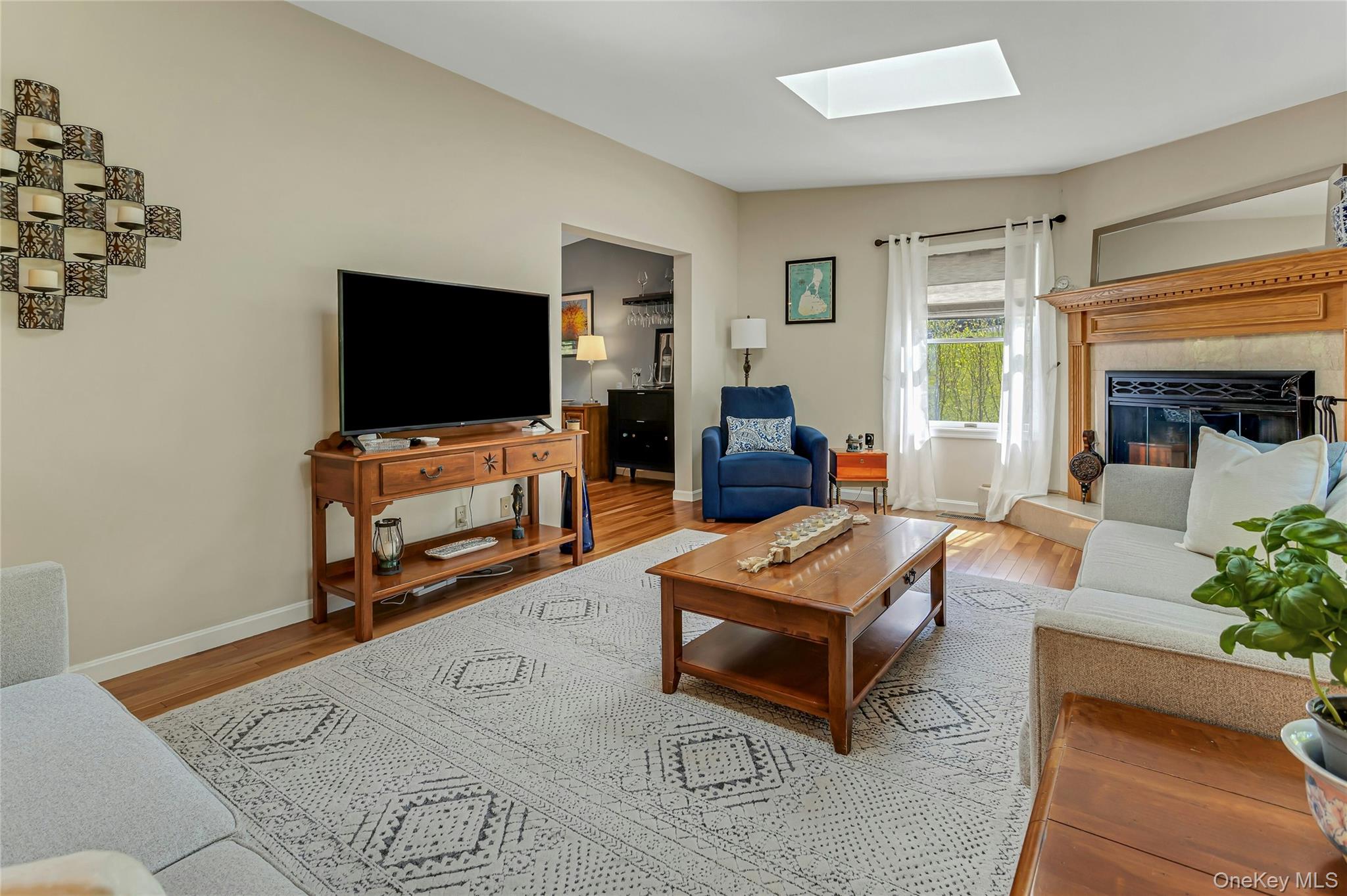 340 Osceola Road Jefferson Valley, NY 10535 - Photo 11 of 48 a living room with furniture and a flat screen tv