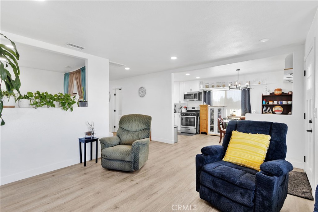 15109 Anacapa Road Victorville, CA 92392 - Photo 14 of 40 a living room with furniture and wooden floor