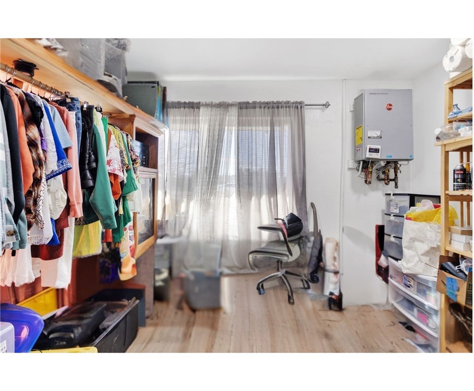 15109 Anacapa Road Victorville, CA 92392 - Photo 25 of 40 a room with lots of stuff and hardwood floor