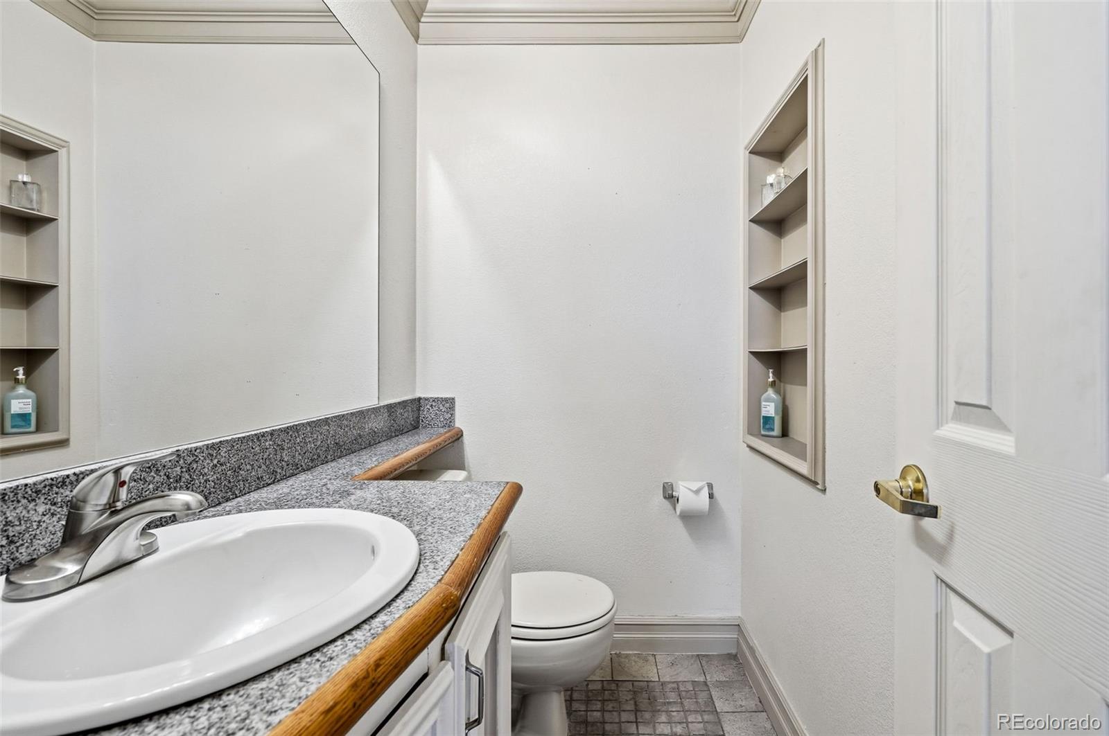 9280 Wigham Street Thornton, CO 80229 - Photo 25 of 34 a bathroom with a sink a toilet and shower