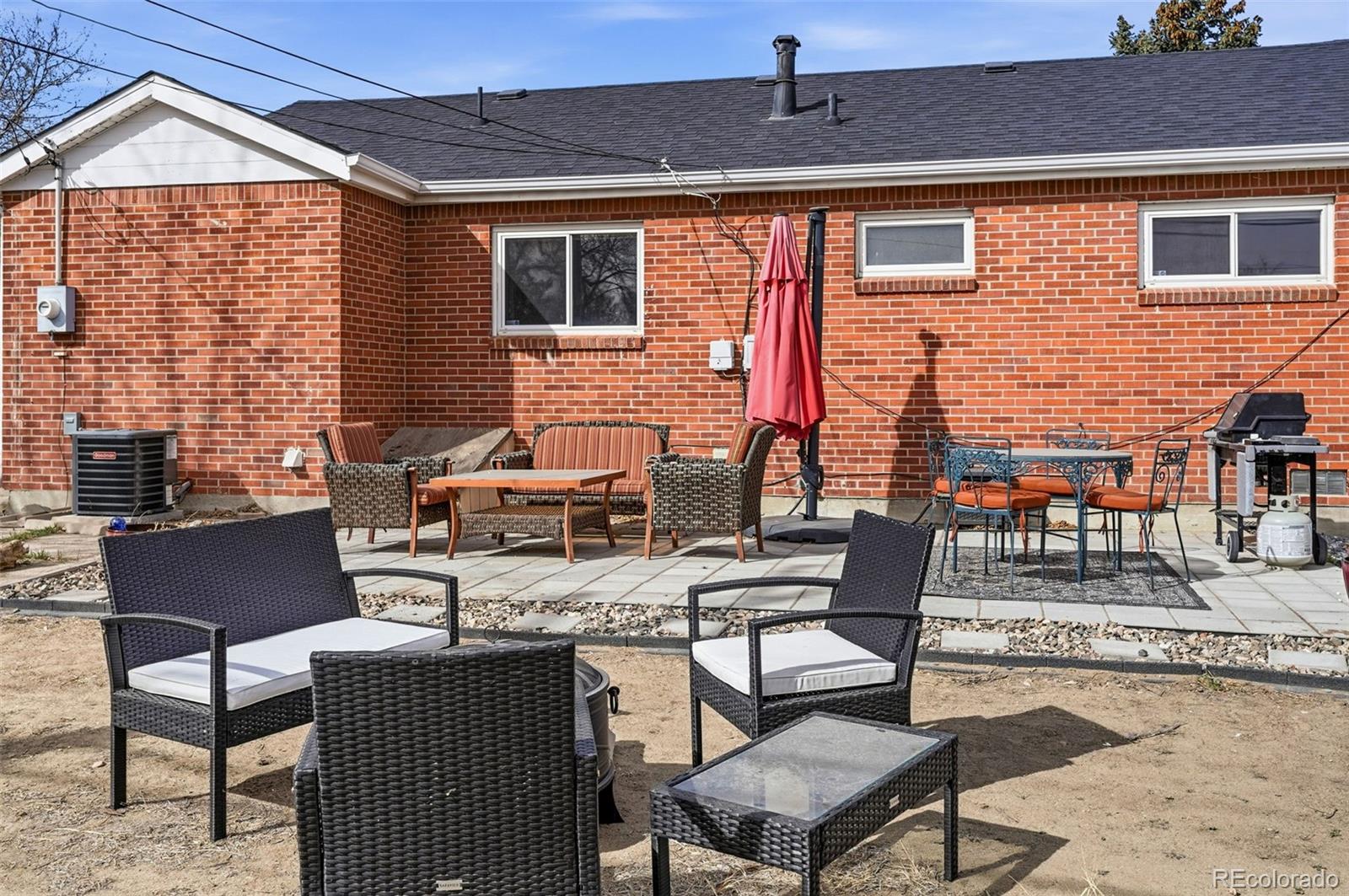 9280 Wigham Street Thornton, CO 80229 - Photo 26 of 34 a outdoor space with patio the couches and a dining table with chairs