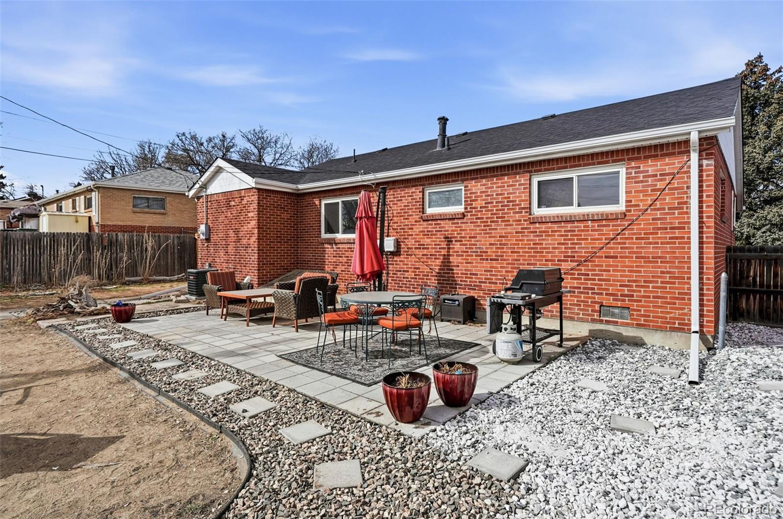 9280 Wigham Street Thornton, CO 80229 - Photo 28 of 34 a building outdoor space with patio furniture
