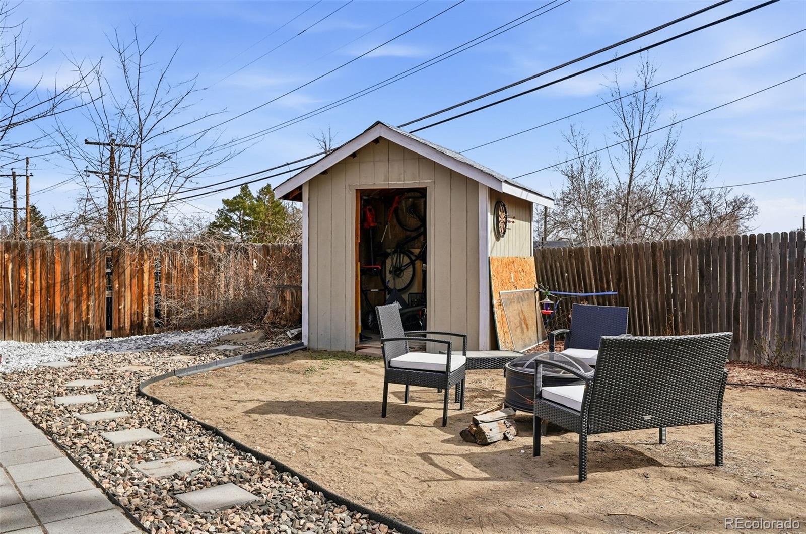 9280 Wigham Street Thornton, CO 80229 - Photo 29 of 34 a backyard of a house with table and chairs