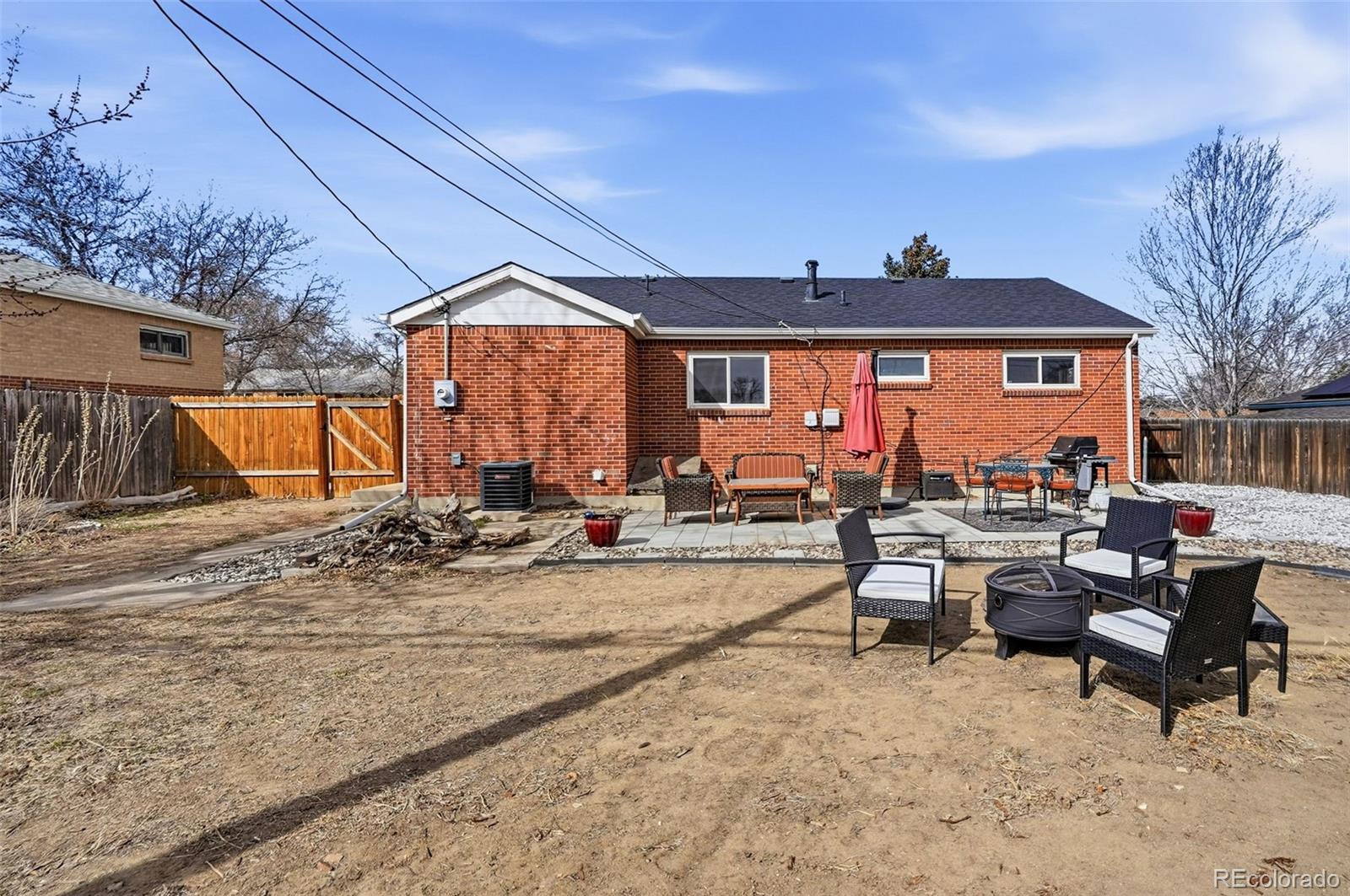 9280 Wigham Street Thornton, CO 80229 - Photo 30 of 34 a view of a terrace with chairs and a patio