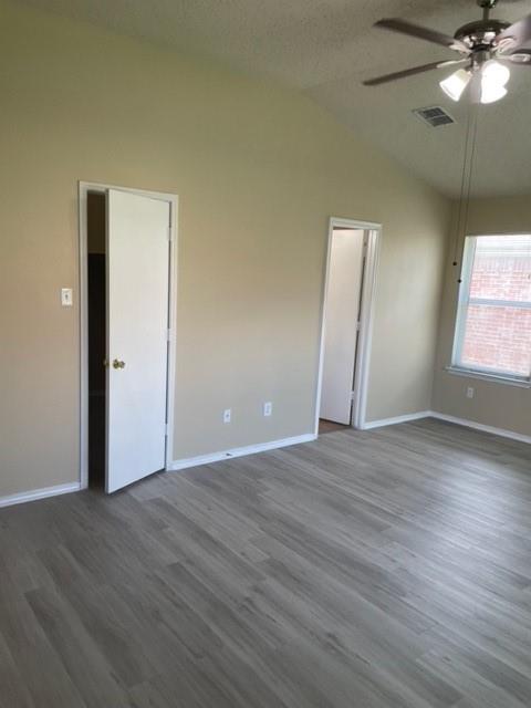 4753 Sea Ridge Drive Fort Worth, TX 76133 - Photo 13 of 16 an empty room with wooden floor and windows