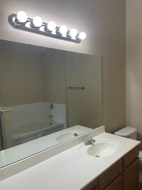 4753 Sea Ridge Drive Fort Worth, TX 76133 - Photo 14 of 16 a bathroom with a sink and a mirror