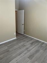 4753 Sea Ridge Drive Fort Worth, TX 76133 - Photo 2 of 16 an empty room with wooden floor