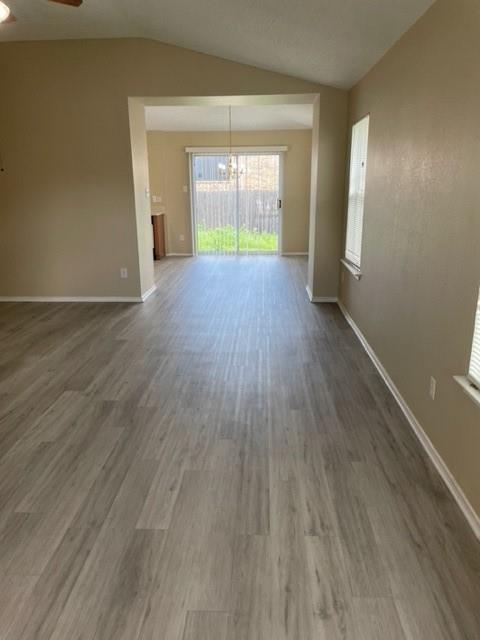 4753 Sea Ridge Drive Fort Worth, TX 76133 - Photo 3 of 16 an empty room with wooden floor and windows