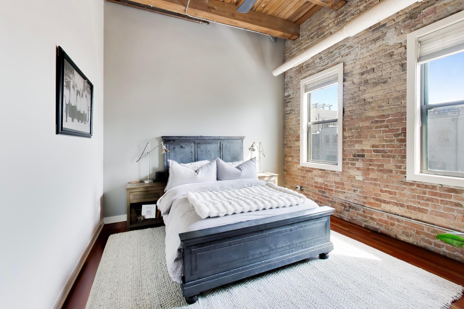 1050 West Hubbard Street, Unit 2F Chicago, IL 60642 - Photo 12 of 33 a spacious bedroom with a bed and window