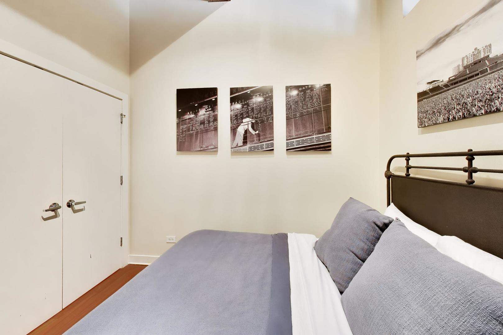 1050 West Hubbard Street, Unit 2F Chicago, IL 60642 - Photo 19 of 33 a bedroom with a bed and closet