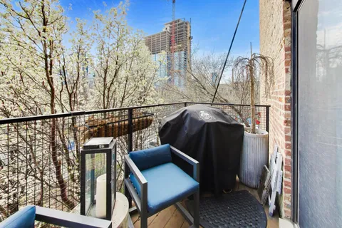 a view of balcony with two chairs