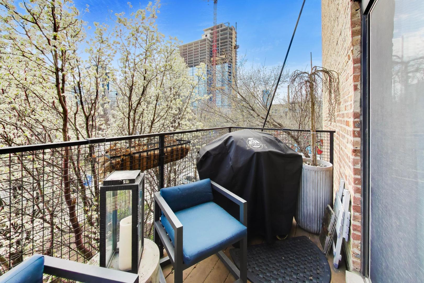 1050 West Hubbard Street, Unit 2F Chicago, IL 60642 - Photo 22 of 33 a view of balcony with two chairs