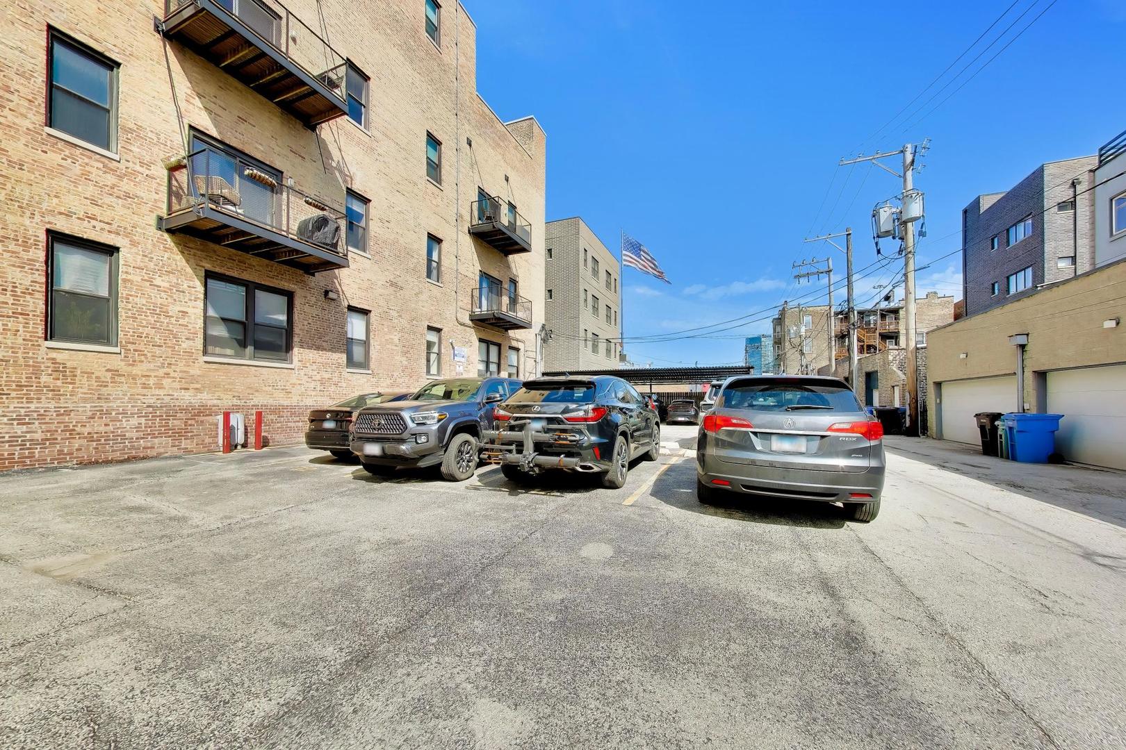 1050 West Hubbard Street, Unit 2F Chicago, IL 60642 - Photo 24 of 33 a car parked in front of a building