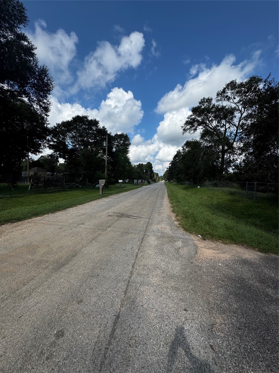 17625 Spanish Oak Conroe, TX 77306 - Photo 10 of 14 a view of a street both side of house with yard and green space