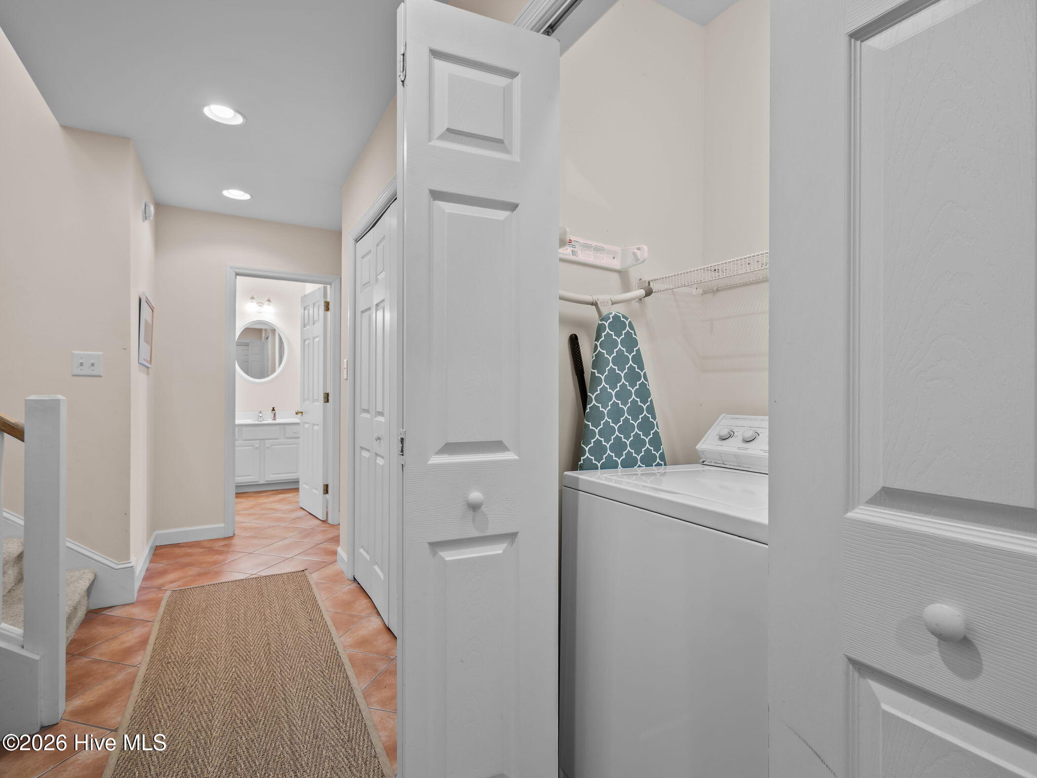 1206 Timber Trail Emerald Isle, NC 28594 - Photo 25 of 39 Hallway with laundry & storage closet on first floor