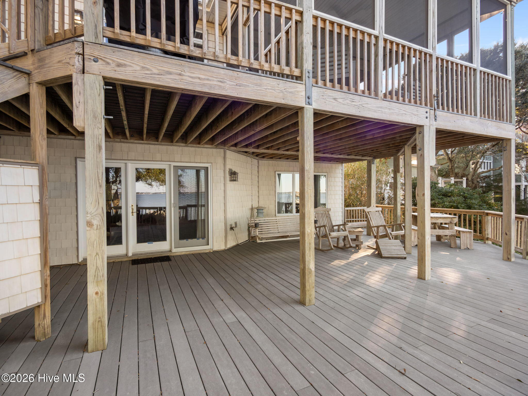 1206 Timber Trail Emerald Isle, NC 28594 - Photo 29 of 39 Large deck off bonus room with steps to back yard