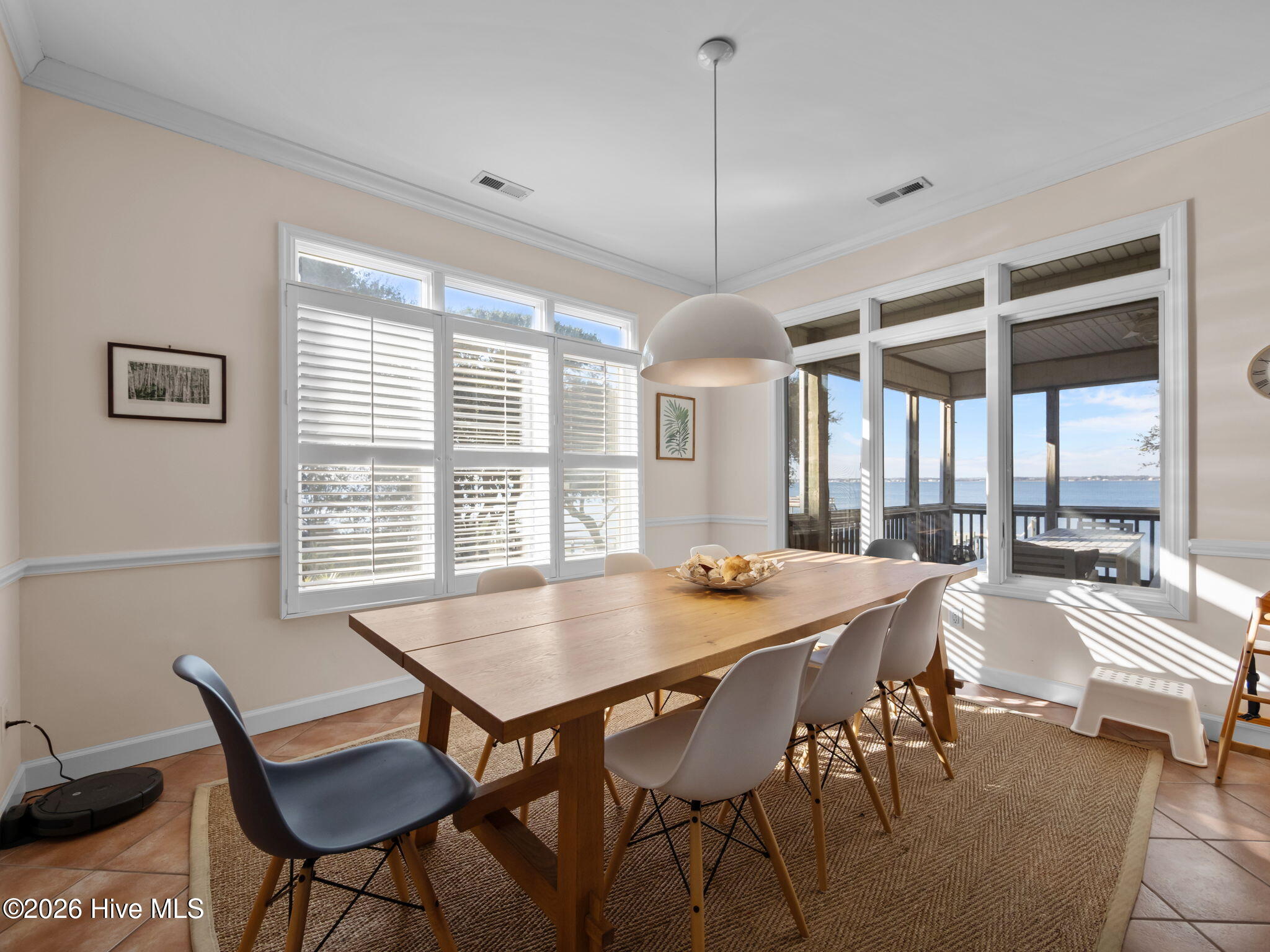 1206 Timber Trail Emerald Isle, NC 28594 - Photo 10 of 39 Dining area overlooking screened porch and sound