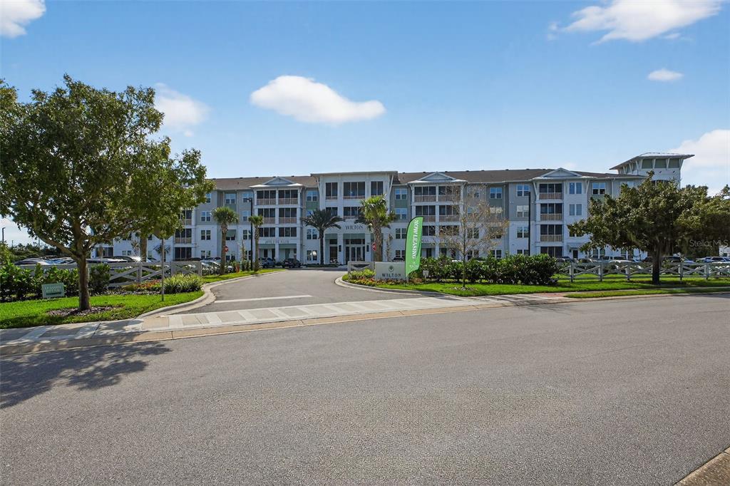 469 Bulldog Drive, Unit 3 Palm Coast, FL 32164 - Photo 33 of 54 a view of a building with a yard