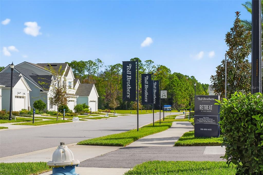 469 Bulldog Drive, Unit 3 Palm Coast, FL 32164 - Photo 42 of 54 a view of a building with a yard