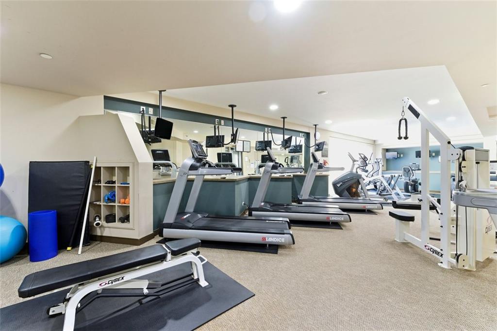 2626 Peachtree Road Northwest, Unit 1006 Atlanta, GA 30305 - Photo 14 of 19 a living room with lots of furniture