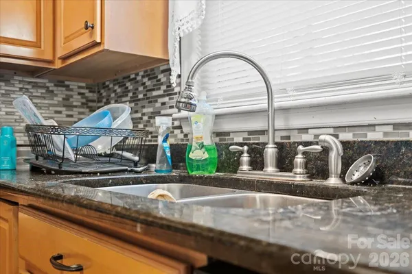 a view of a sink with window