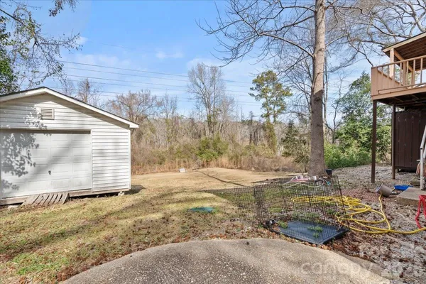 a view of a backyard of the house