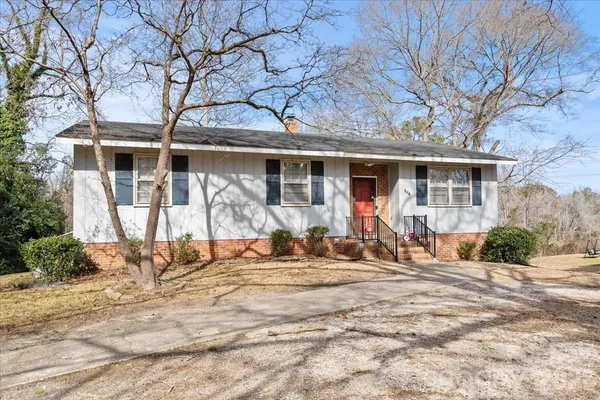 a front view of a house with backyard