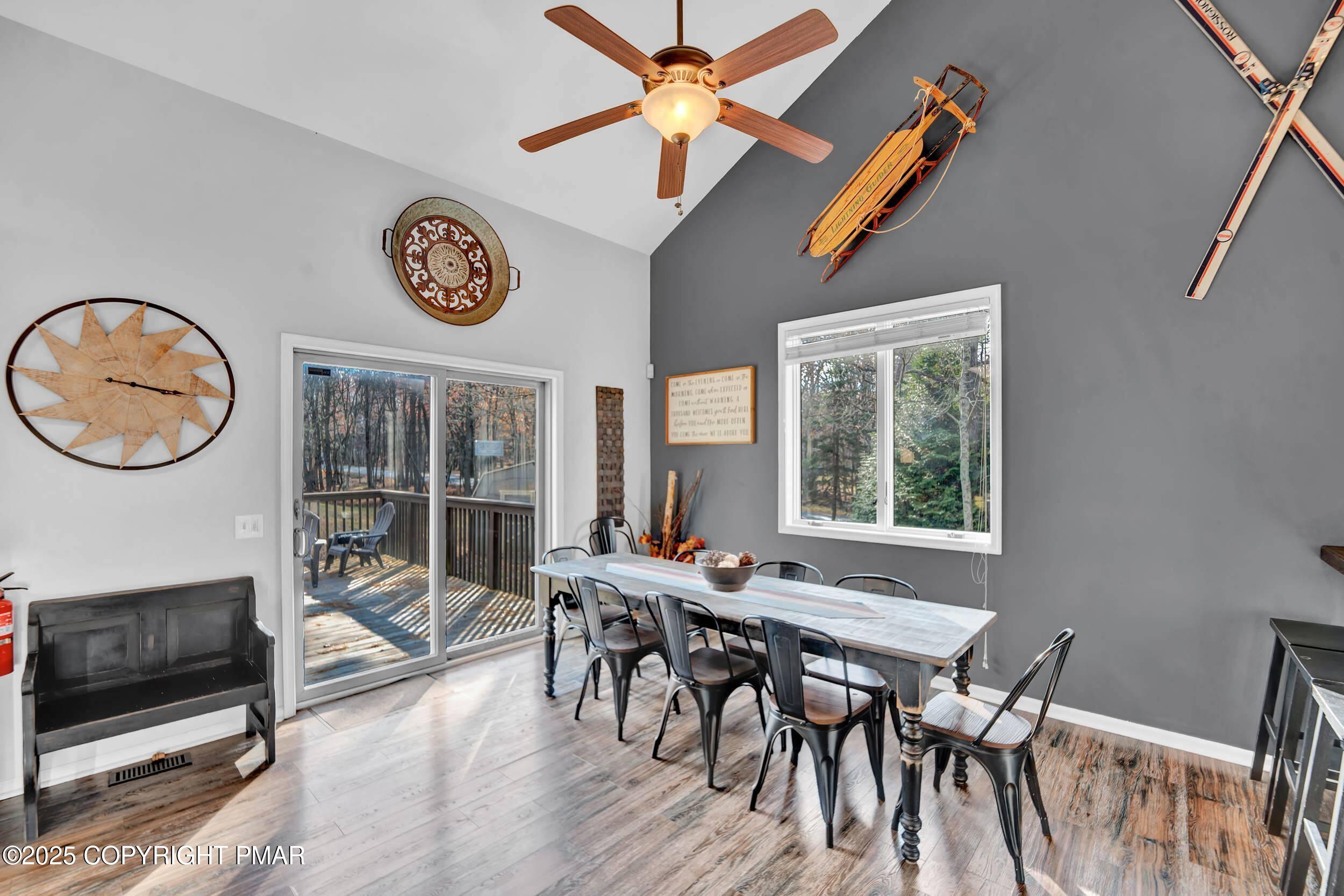 112 Maccauley Road Albrightsville, PA 18210 - Photo 12 of 76 a view of a dining room with furniture a chandelier and a large window