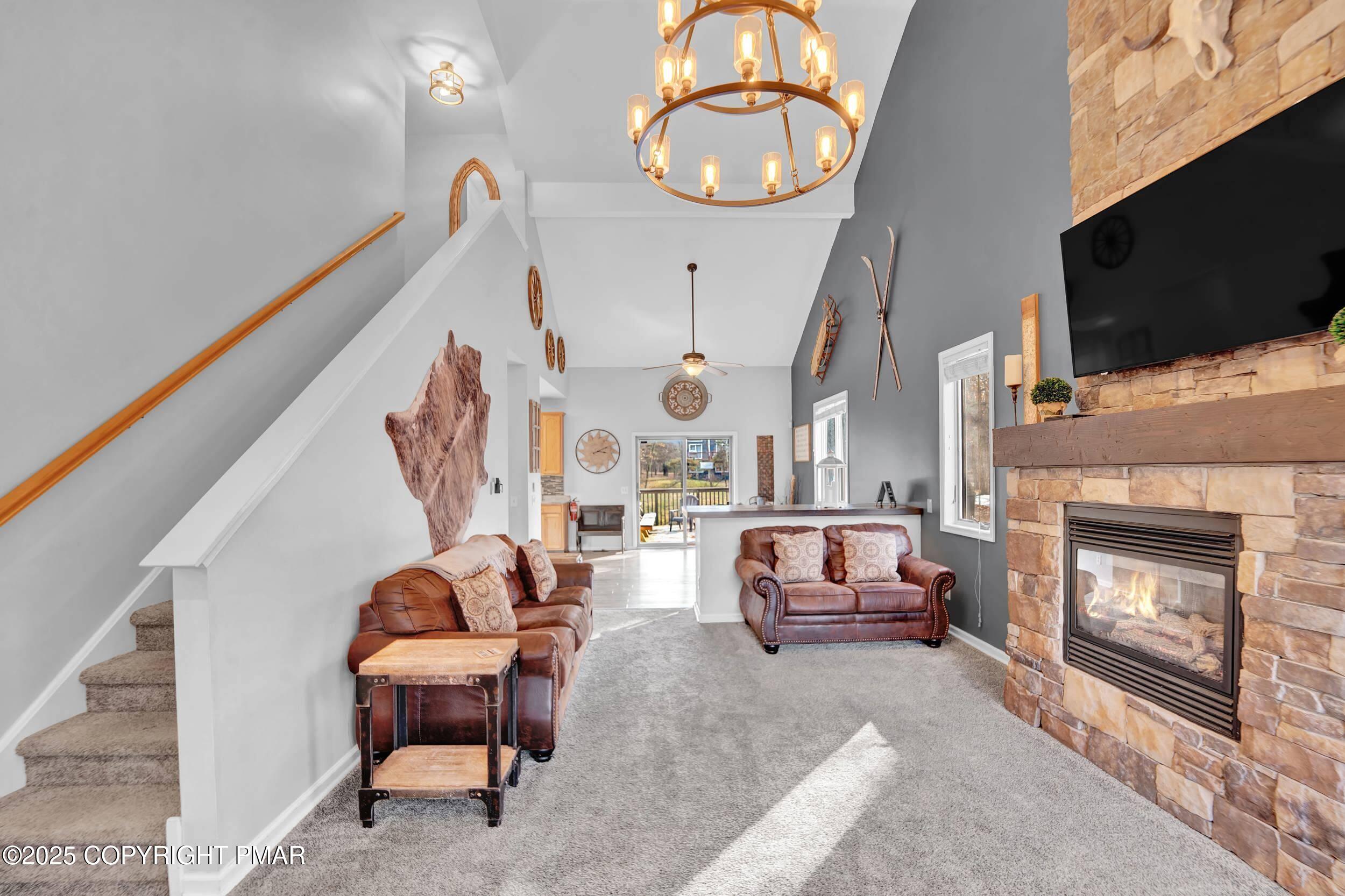 112 Maccauley Road Albrightsville, PA 18210 - Photo 14 of 76 a living room with furniture a flat screen tv and a fireplace